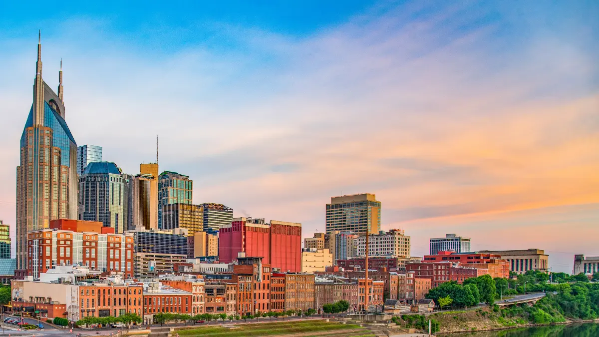 The Nashville skyline at sunset over the Cumberland River